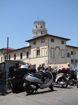 SX19788 Leaning tower of Pisa sticking out over building, Italy.jpg